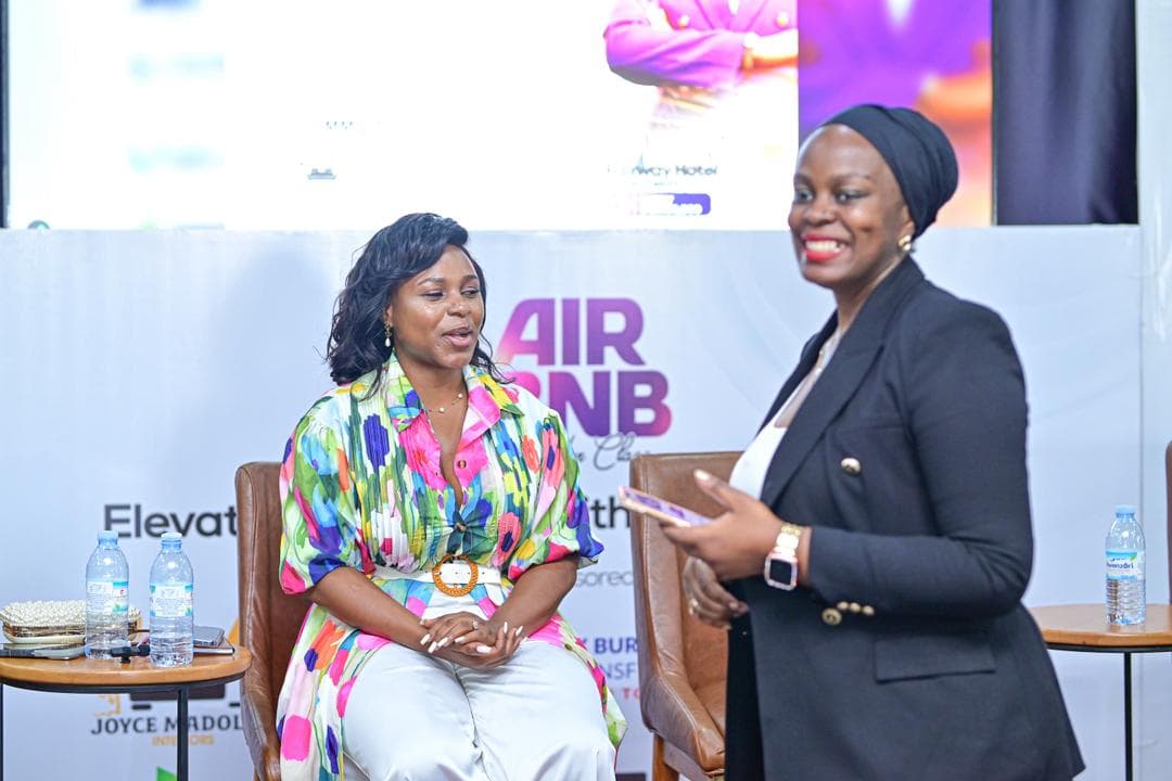 Attendees seated at round table discussions.