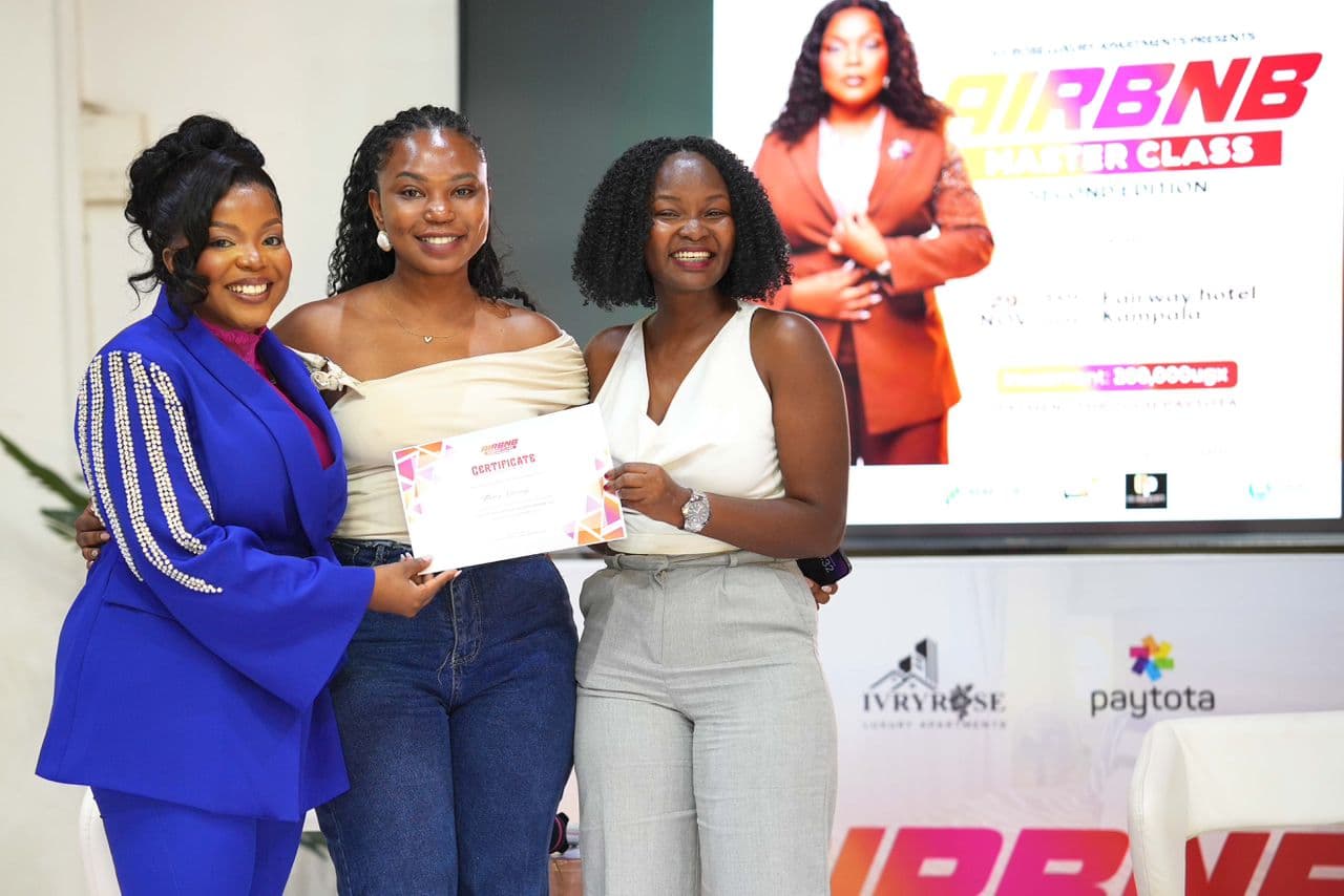 Organizers and guests on stage for a group photo.