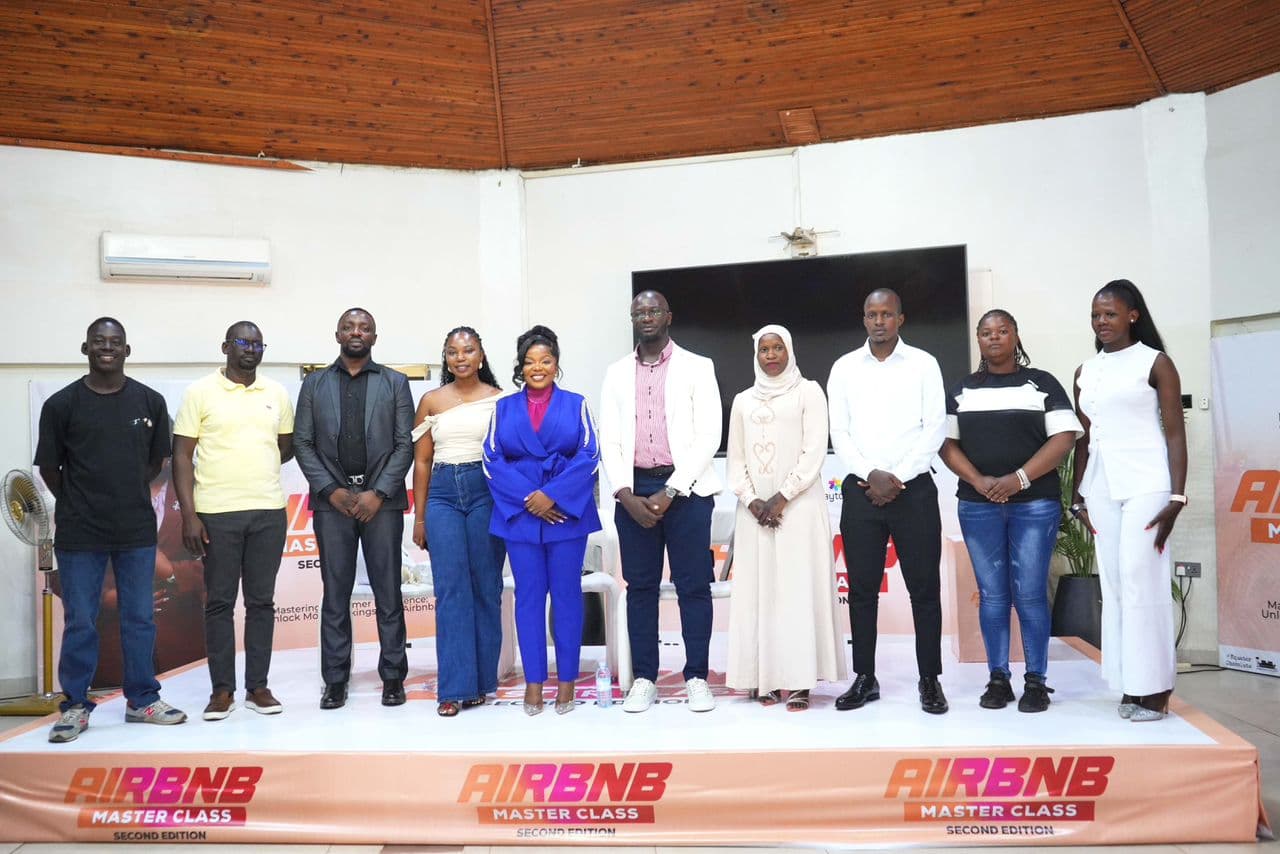 Panel talk on stage with audience in attendance.